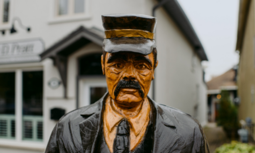 Tree sculpture of man with hat